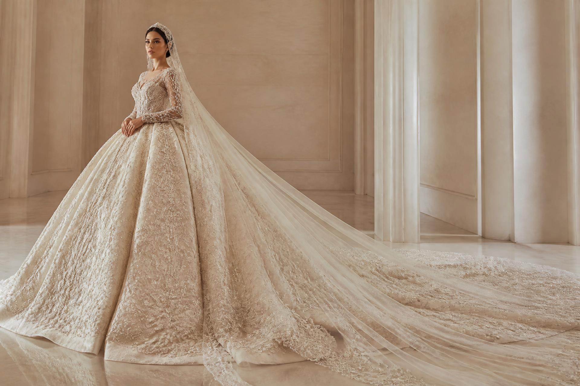 Bride in a hand-beaded ivory couture ball gown with a dramatic cathedral train